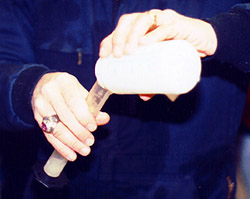 pour semen from collection bottle into warmed graduated cylinder to determine volume